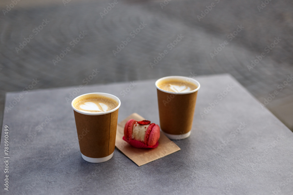 take away coffee with macaron on the street