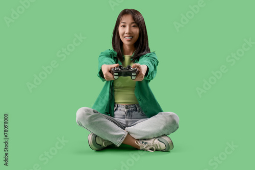 Happy Asian woman holding g...