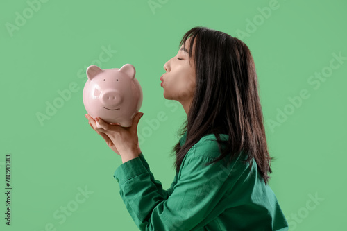 Asian young woman kissing p...