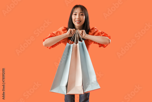 Young Asian woman holding p...