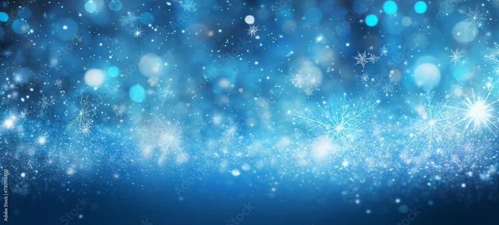 Blue abstract glowing bokeh background with snowflakes