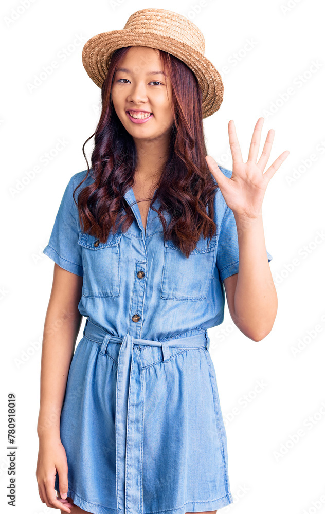 Young beautiful chinese girl wearing summer hat showing and pointing up with fingers number five while smiling confident and happy. Young beautiful chinese girl wearing summer hat showing and pointing up with fingers number five while smiling confident and happy.