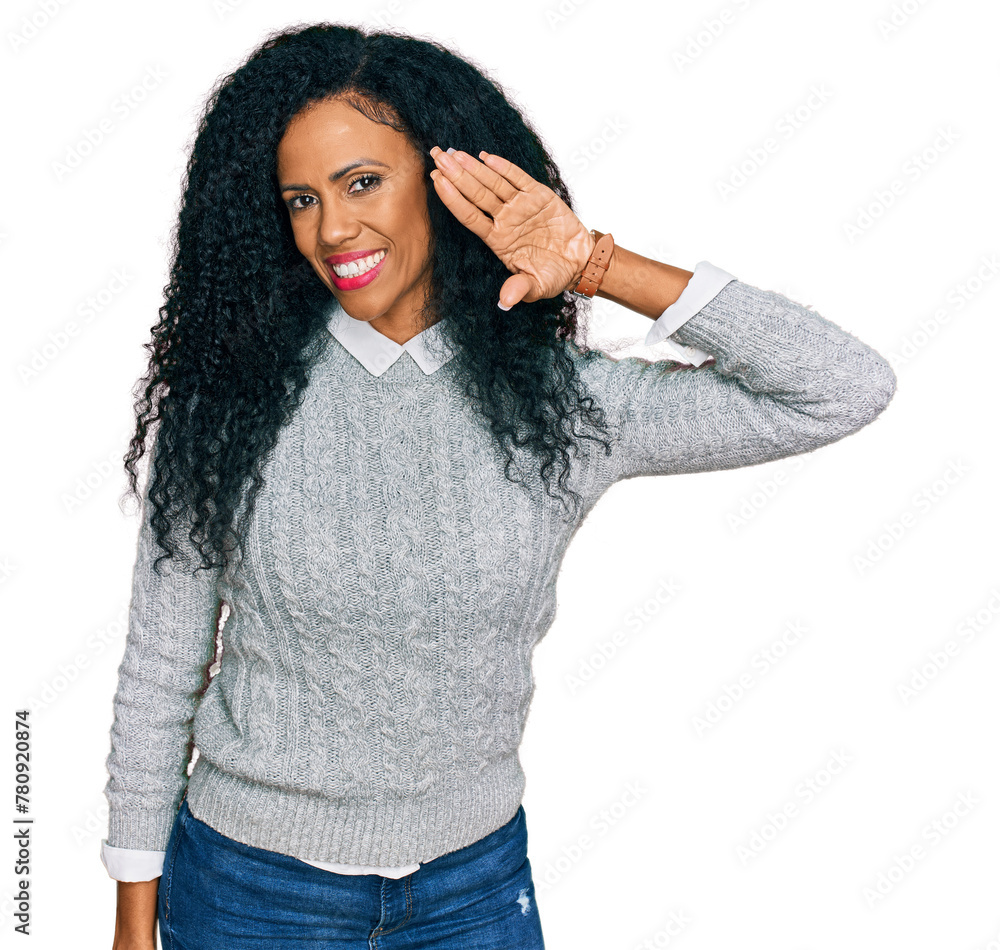 Middle age african american woman wearing casual clothes waiving saying hello happy and smiling, friendly welcome gesture Middle age african american woman wearing casual clothes waiving saying hello happy and smiling, friendly welcome gesture