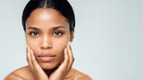Portrait Close-up Picture of a Concerned and Caring African American Woman, Touch Her Face Skin with Fingers, Worried About Skincare and Stress. Open text or Copy area space for Advertisement Caption.
