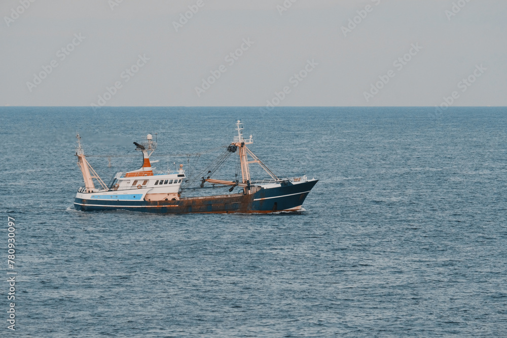 Boat At Sea Engaged In Fishing Operation Boat At Sea Engaged In Fishing Operation