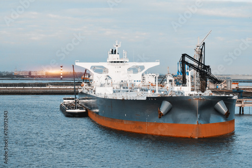 Very Large Crude Oil Carrier Tanker In The Trade Port During Bunkering Fuel Operations.