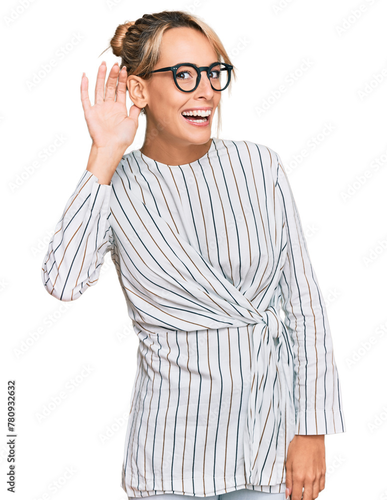 Beautiful blonde woman wearing business shirt and glasses smiling with hand over ear listening an hearing to rumor or gossip. deafness concept. Beautiful blonde woman wearing business shirt and glasses smiling with hand over ear listening an hearing to rumor or gossip. deafness concept.