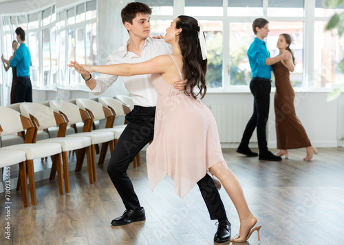 Tango performed by young couple in a choreographic studio