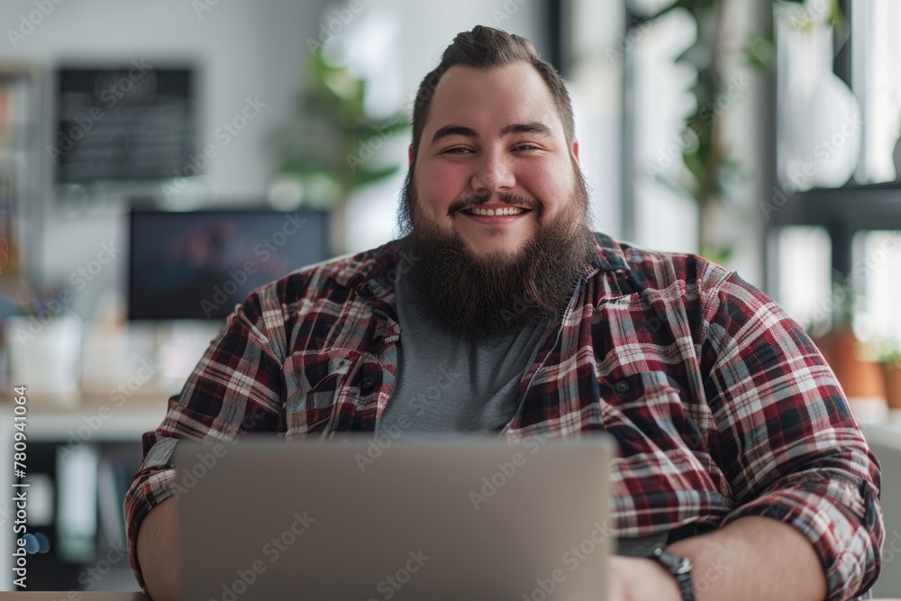 A man sitting at a table with a laptop. Ideal for illustrating modern work environments A man sitting at a table with a laptop. Ideal for illustrating modern work environments