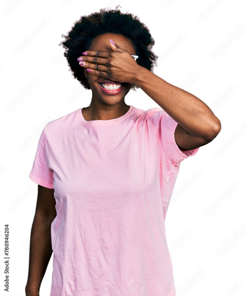 African american woman with afro hair wearing casual clothes and glasses smiling and laughing with hand on face covering eyes for surprise. blind concept. African american woman with afro hair wearing casual clothes and glasses smiling and laughing with hand on face covering eyes for surprise. blind concept.