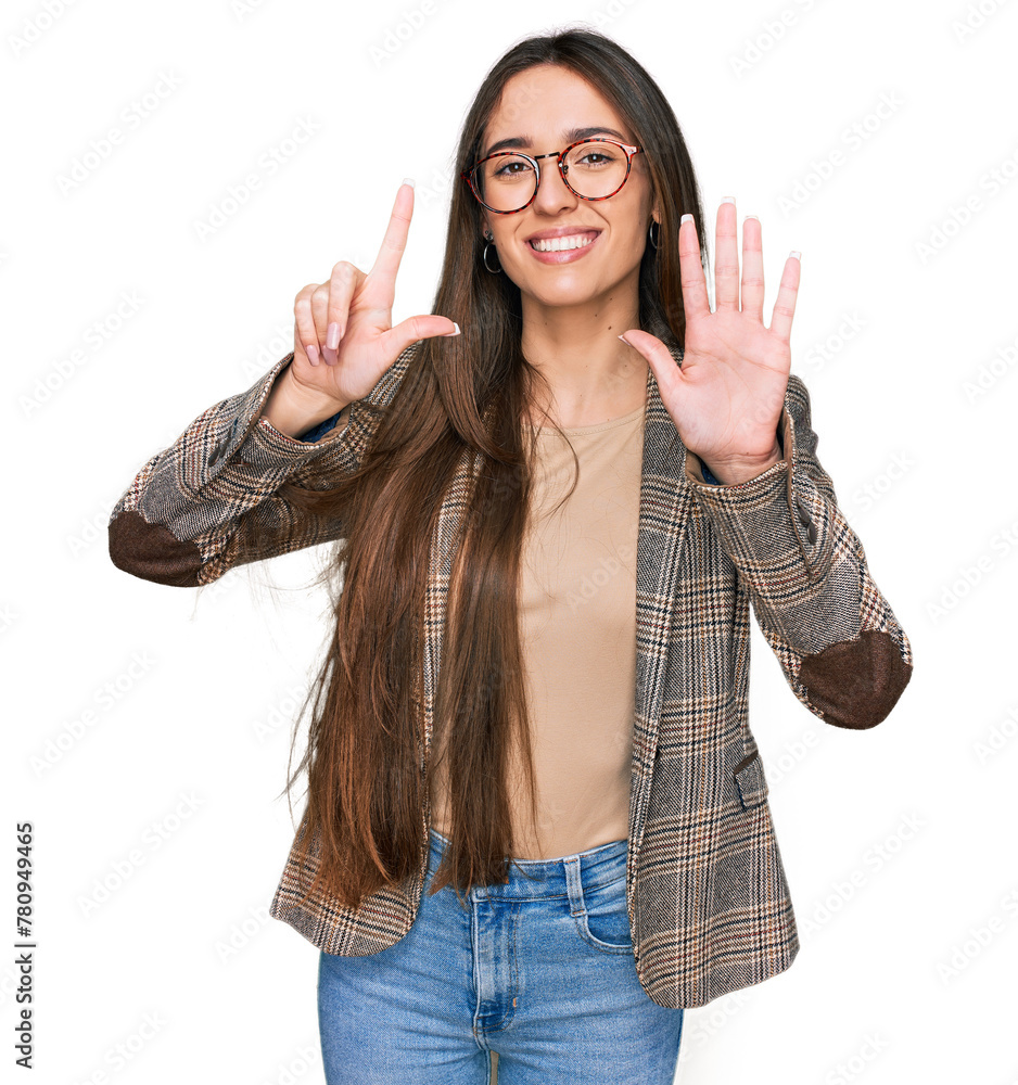 Φωτογραφία Young hispanic girl wearing business clothes and glasses showing and pointing up with fingers number seven while smiling confident and happy