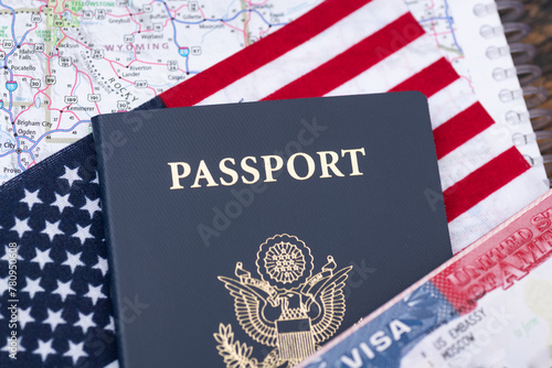 United States of America Passport and Visa on US Flag background. concept of obtaining US citizenship and freedom of movement.