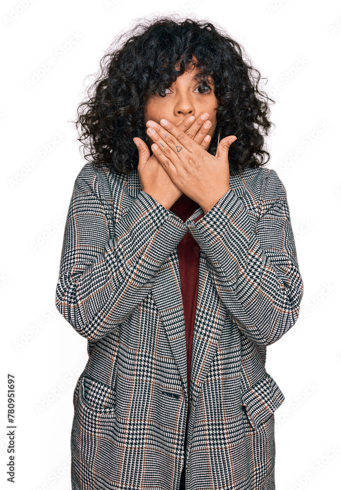 Young hispanic woman wearing business clothes shocked covering mouth with hands for mistake. secret concept. Young hispanic woman wearing business clothes shocked covering mouth with hands for mistake. secret concept.