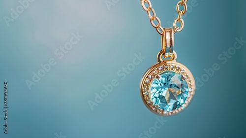 An elegance gold pendant necklace adorned with blue topaz gemstones is set against a blue background, highlighting fashion jewelry with natural gemstones in a luxurious presentation