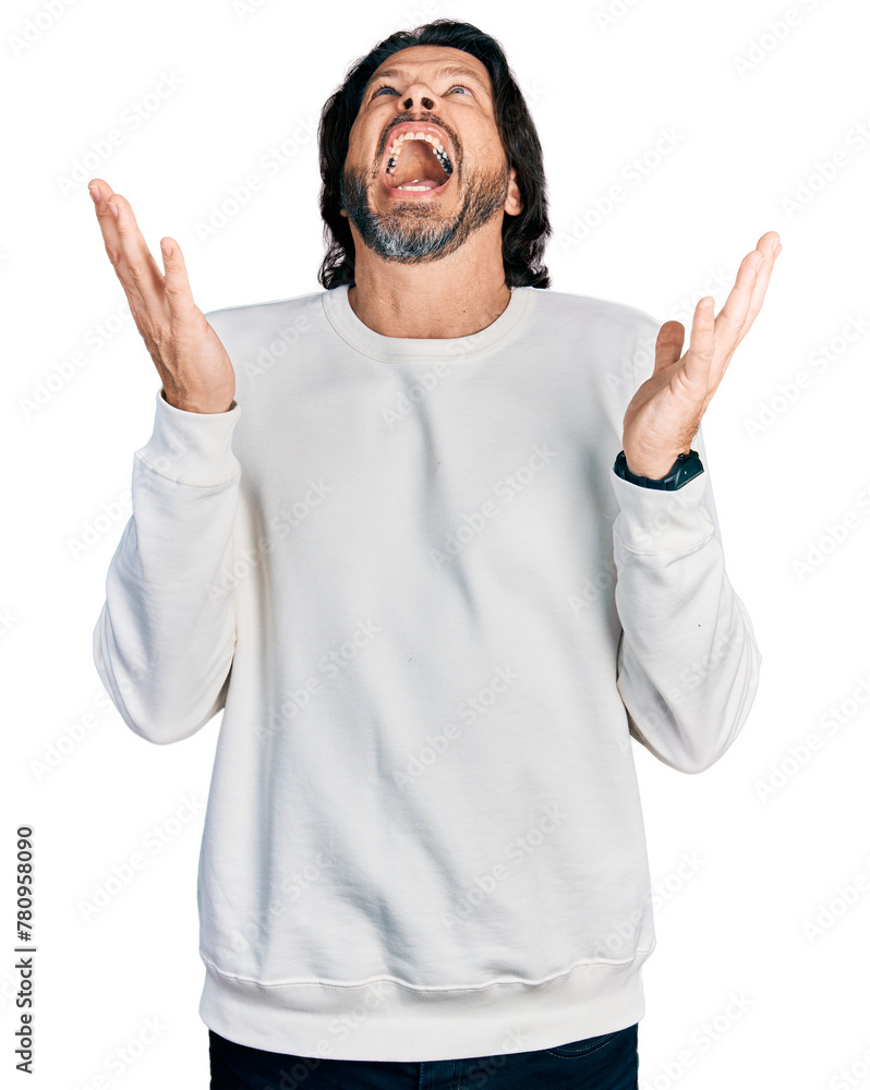 Φωτογραφία Middle age caucasian man wearing casual clothes celebrating mad and crazy for success with arms raised and closed eyes screaming excited