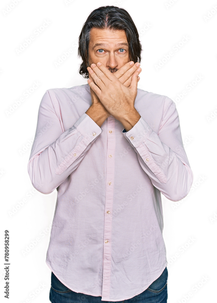 Middle age handsome man wearing business shirt shocked covering mouth with hands for mistake. secret concept. Middle age handsome man wearing business shirt shocked covering mouth with hands for mistake. secret concept.