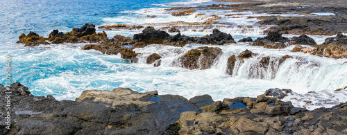 Waves Washing Over The Rocky Volcanic Shoreline at Wawalili Beach, Wawaloli Beach Park, Hawaii Island, Hawaii, USA