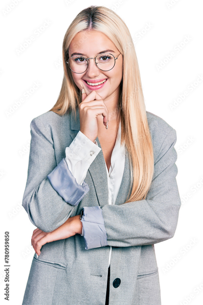 Beautiful blonde woman wearing business jacket and glasses looking confident at the camera with smile with crossed arms and hand raised on chin. thinking positive. Beautiful blonde woman wearing business jacket and glasses looking confident at the camera with smile with crossed arms and hand raised on chin. thinking positive.