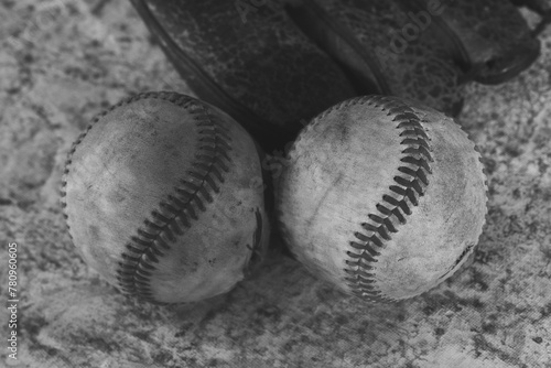 Baseball nostalgia background with dirty used balls in black and white.