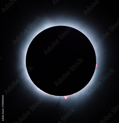 Solar eclipse with red solar prominences © jdross75