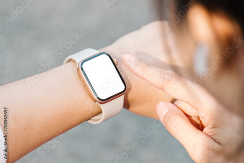 Obraz na plátně Close-up of a person wrist wearing a modern smartwatch with a blank screen, indicating connectivity and technology in everyday life