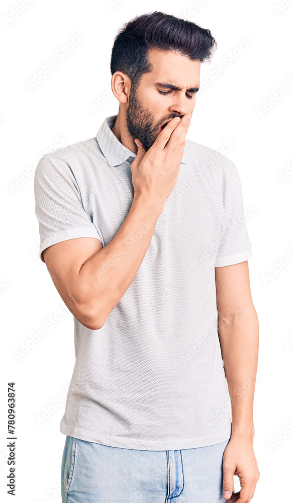 Young handsome man with beard wearing casual polo bored yawning tired covering mouth with hand. restless and sleepiness. Young handsome man with beard wearing casual polo bored yawning tired covering mouth with hand. restless and sleepiness.