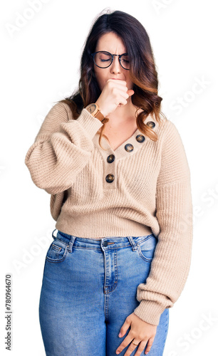 Beautiful young brunette woman wearing casual clothes and glasses feeling unwell and coughing as symptom for cold or bronchitis. health care concept.