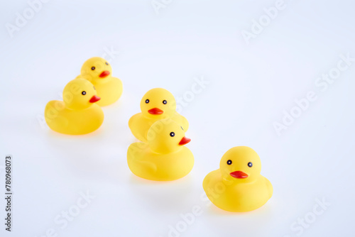 Five Yellow rubber ducks on a white background