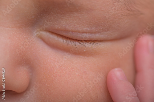 Newborn baby closed clse up eye