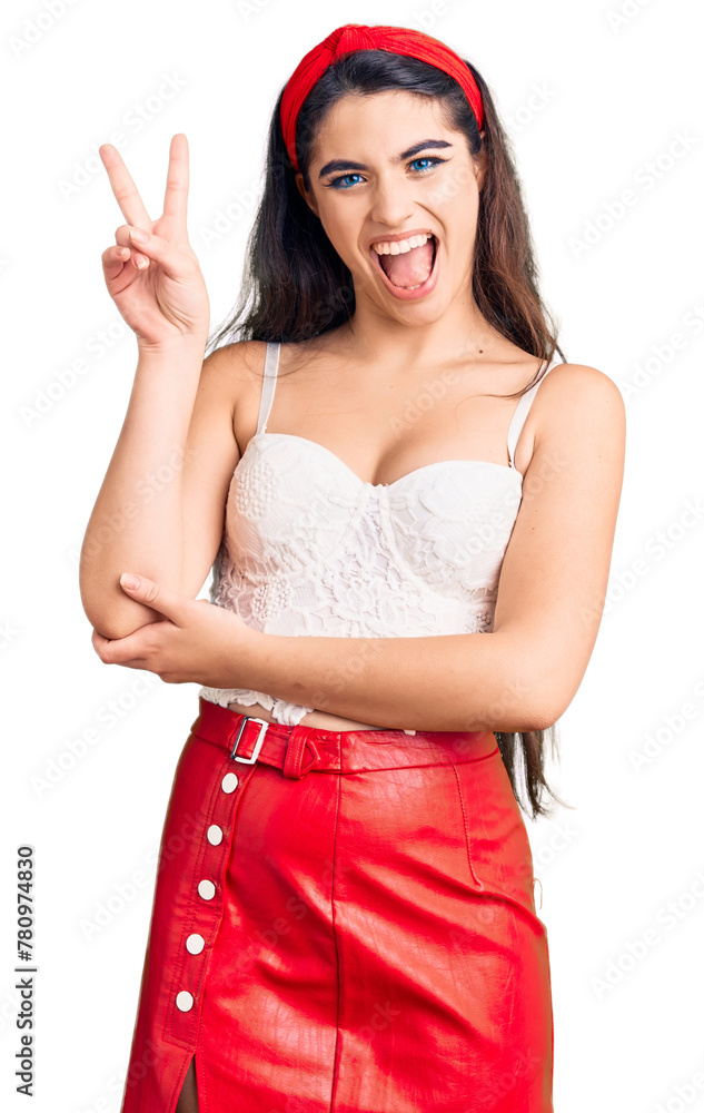 Brunette teenager girl wearing elegant look smiling with happy face winking at the camera doing victory sign. number two. Brunette teenager girl wearing elegant look smiling with happy face winking at the camera doing victory sign. number two.