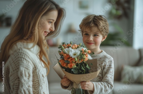 A young boy is holding a bouquet of flowers for a woman. Happy Mother's Day concept