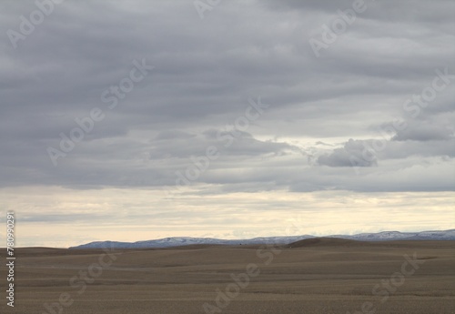 land with white sky and cloulds