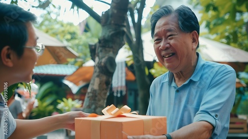 Generative AI   Asian man surprised elderly father with Birthday gift at outdoor cafe restaurant 