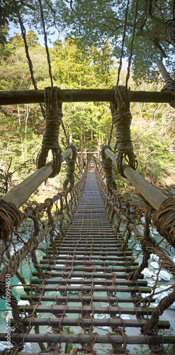 Walking on Kazurabashi rope bridge on Shikoku, Japan photo