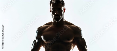Close up of a toned and fit man with no shirt showing off his muscular body photo