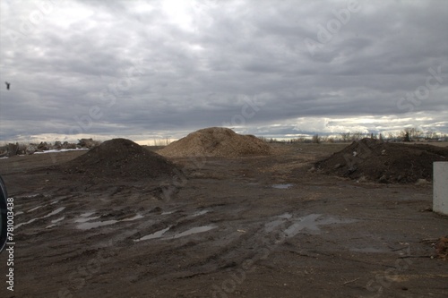 three piles with sky background