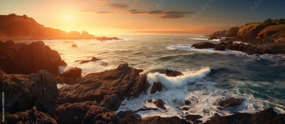 Rocky beach with turbulent waves breaking against the rugged rocks close up Rocky beach with turbulent waves breaking against the rugged rocks close up