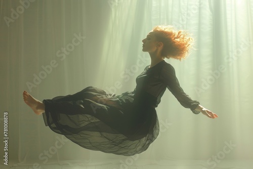 A woman with wild red hair levitates dreamily in a sunlit room, creating a surreal and ethereal scene. photo