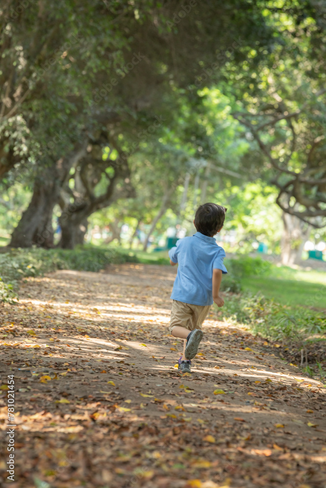 Child running free and happy in a park in Lima peru Child running free and happy in a park in Lima peru