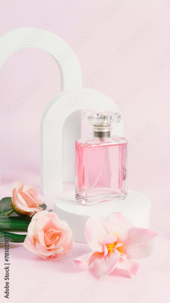 Transparent bottle of perfume on a pink background. Fragrance presentation with daylight. Trending concept in natural materials with window shadow. Perfume sweet pink roses template for advertising. Transparent bottle of perfume on a pink background. Fragrance presentation with daylight. Trending concept in natural materials with window shadow. Perfume sweet pink roses template for advertising.
