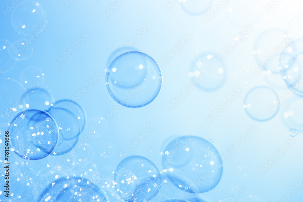Beautiful Transparent Soap Bubbles Floating in The Air.  Celebration Festive Backdrop. Freshness Soap Suds Bubbles Water. Abstract Blue Textured Background.	