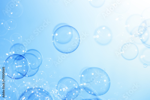 Beautiful Transparent Soap Bubbles Floating in The Air. Celebration Festive Backdrop. Freshness Soap Suds Bubbles Water. Abstract Blue Textured Background. 