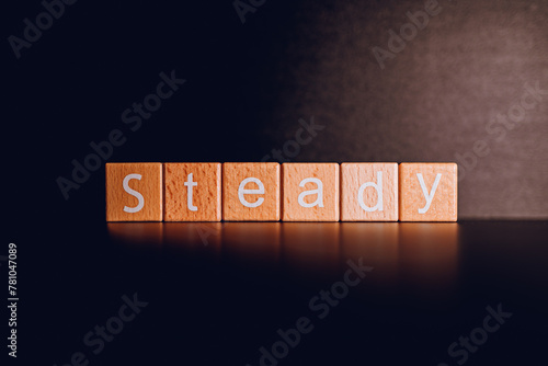 Wooden blocks form the text 