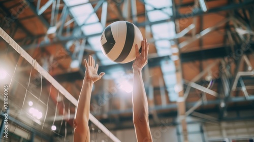 A close-up of a volleyball player's hands setting the ball for a teammate's spike.