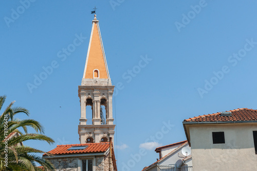 Traditional style European church tower against blue sky