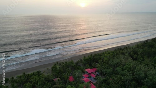 Sunset above the Pacific Ocean at remote Playa Cuevita in the Chocó department of Colombia photo