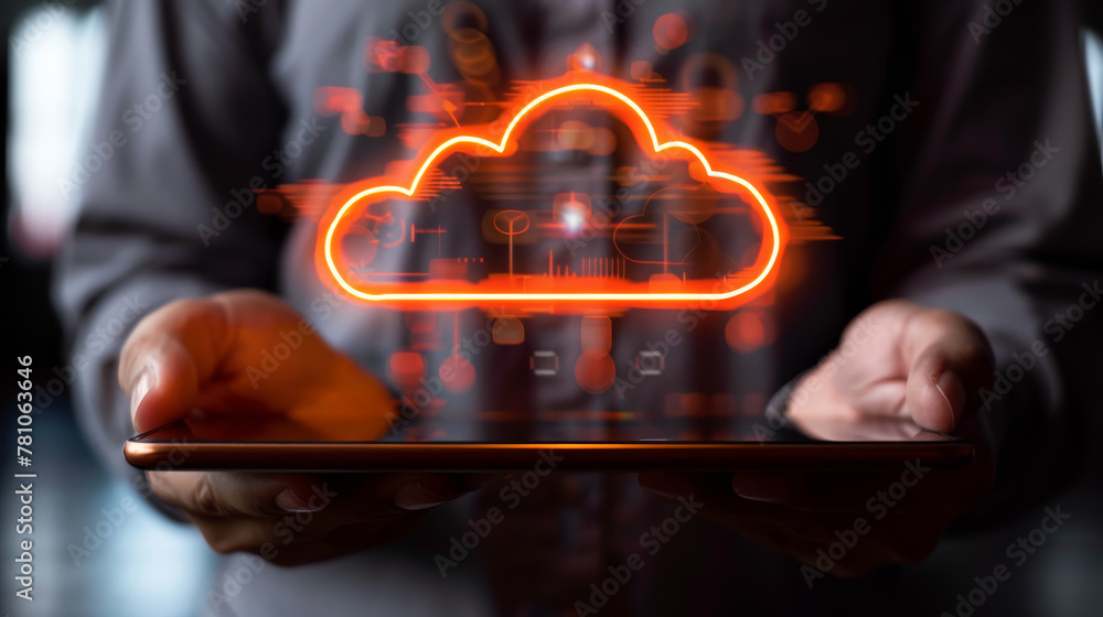 Obraz premium Person holding a tablet with a glowing cloud symbol above it, representing cloud data storage technology on a dark background. Generative AI