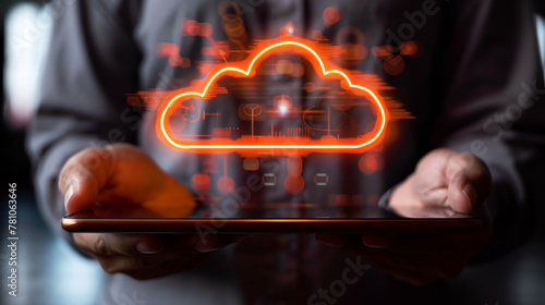 Person holding a tablet with a glowing cloud symbol above it, representing cloud data storage technology on a dark background. Generative AI