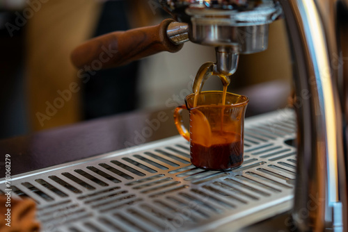 Coffee pouring into glasses in coffee shop  espresso pouring from coffee machine