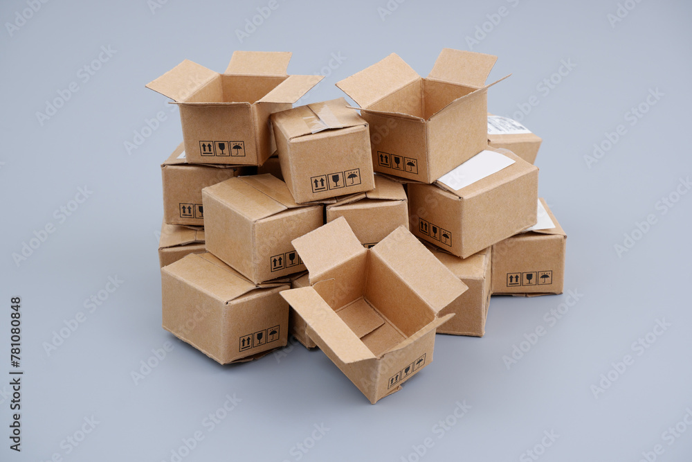 Shipping carton boxes on gray background. Packing and delivery concept. Shipping carton boxes on gray background. Packing and delivery concept.